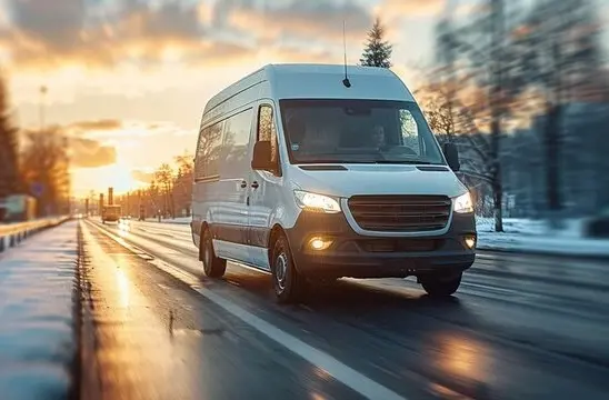 courier and freight delivery services courier van driving down a road