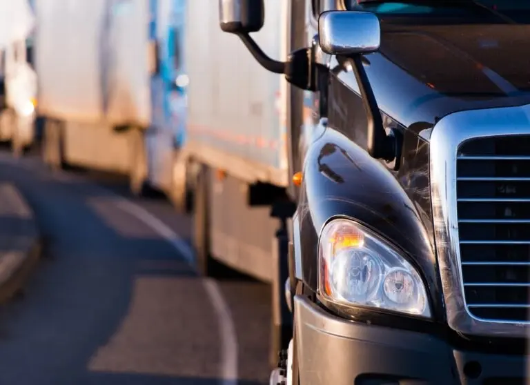 supply chain management tractor-trailers driving down a highway