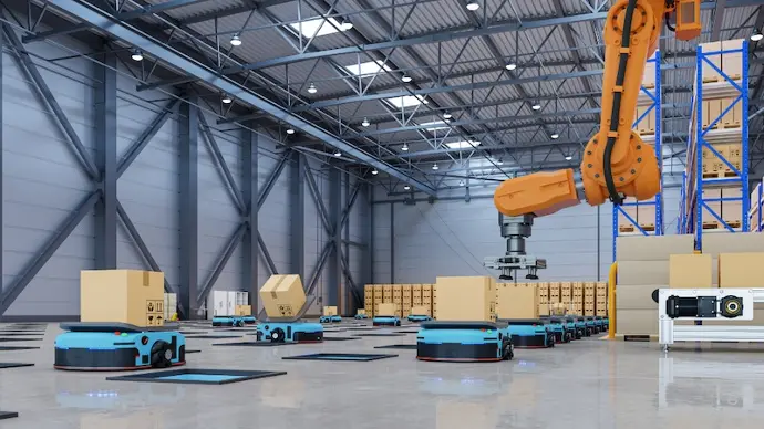 an overhead robot arm placing packages on mini motorized robots for warehouse fullfillment