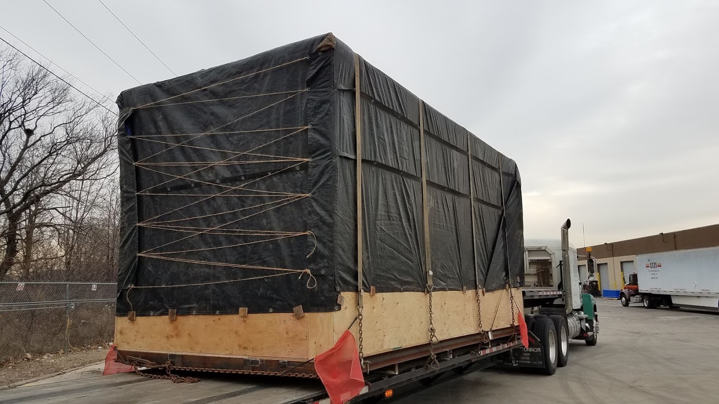 oversized freight delivered on a flat bed tractor trailer